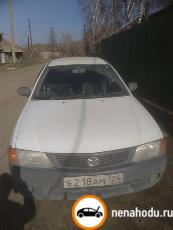 Битый автомобиль Mazda Familia